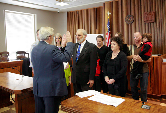 Orange County Judge Carl Thibodeaux is being sworn in